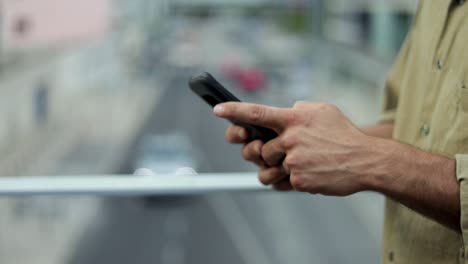 Cropped-shot-of-man-using-smartphone